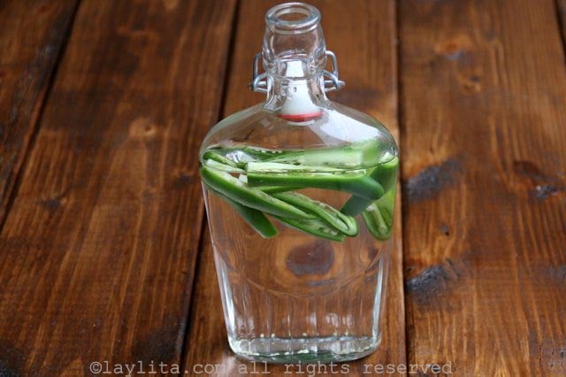Making serrano hot pepper infused spicy tequila