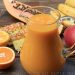 Easy recipe for a refreshing tropical fruit smoothie made with papaya, banana, pineapple, mango, and orange.