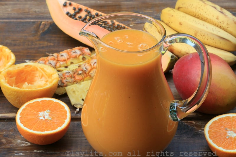 Tropical fruit smoothie with papaya pineapple banana mango and orange