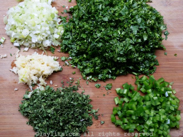 Chopped herbs and crushed garlic for chimichurri sauce