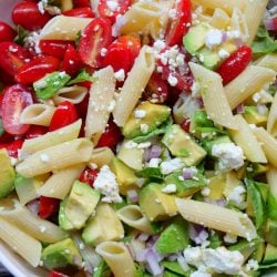 Avocado pasta salad with tomatoes and feta cheese