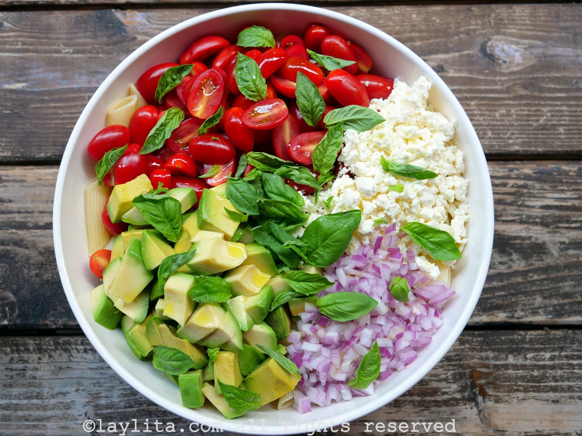 Pasta salad with avocado, tomatoes and cheese