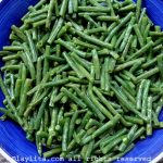 Toss the cooked green beans with the dressing