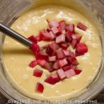 Stir in the ½ cup of diced rhubarb/sugar mix to the cake batter and mix with a spoon.