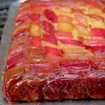 Upside down rhubarb cake on a silver platter