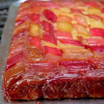 Upside down rhubarb cake on a silver platter