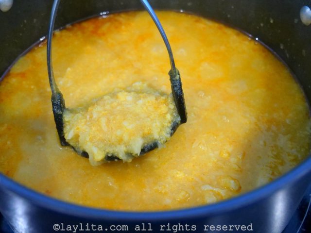 Use a potato masher to mash the cauliflower and potatoes
