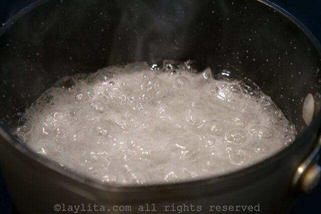 Sugar and water simmering while still a white color
