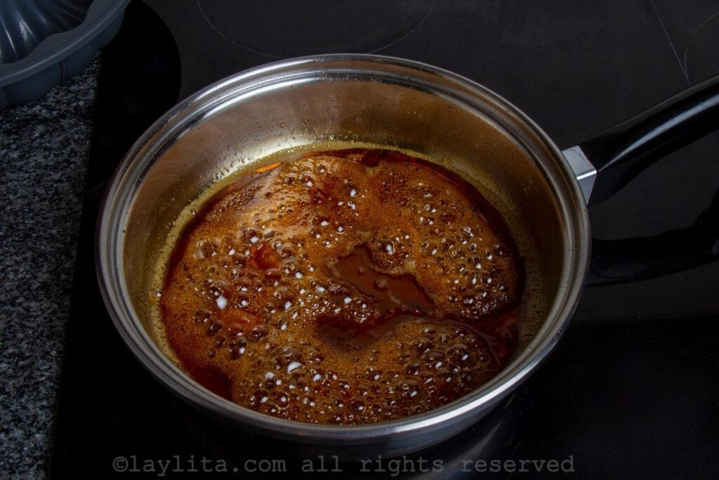 Caramel being simmered in a saucepan