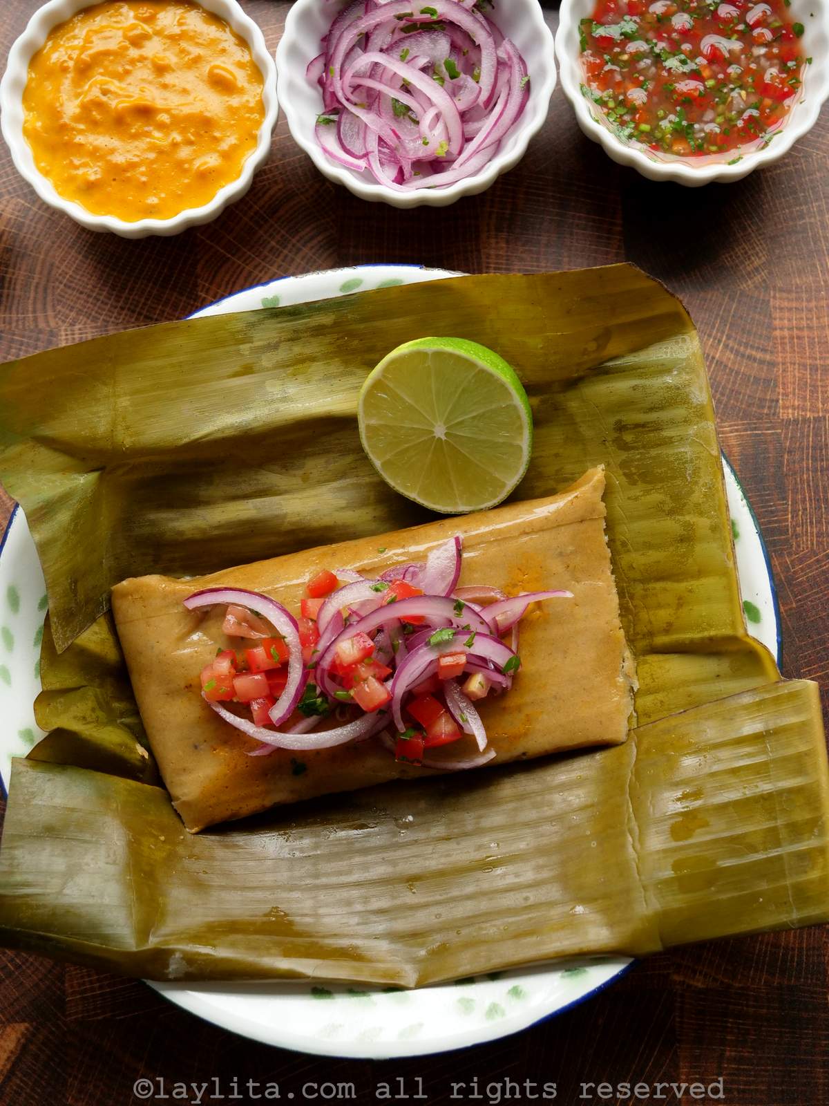 Ecuadorian bollo de pescado with pickled onions, peanut sauce and aji hot sauce