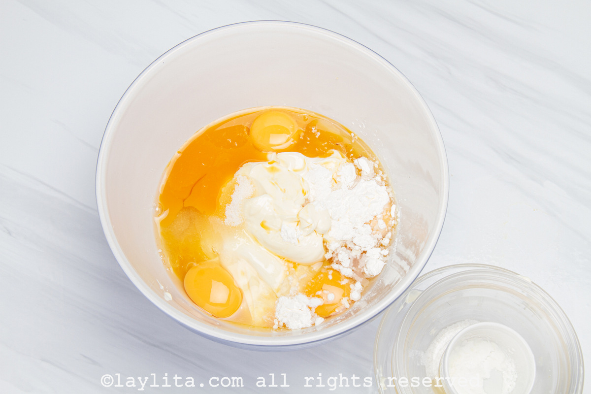 Ingredients needed for the cheesecake mixture in a mixing bowl.