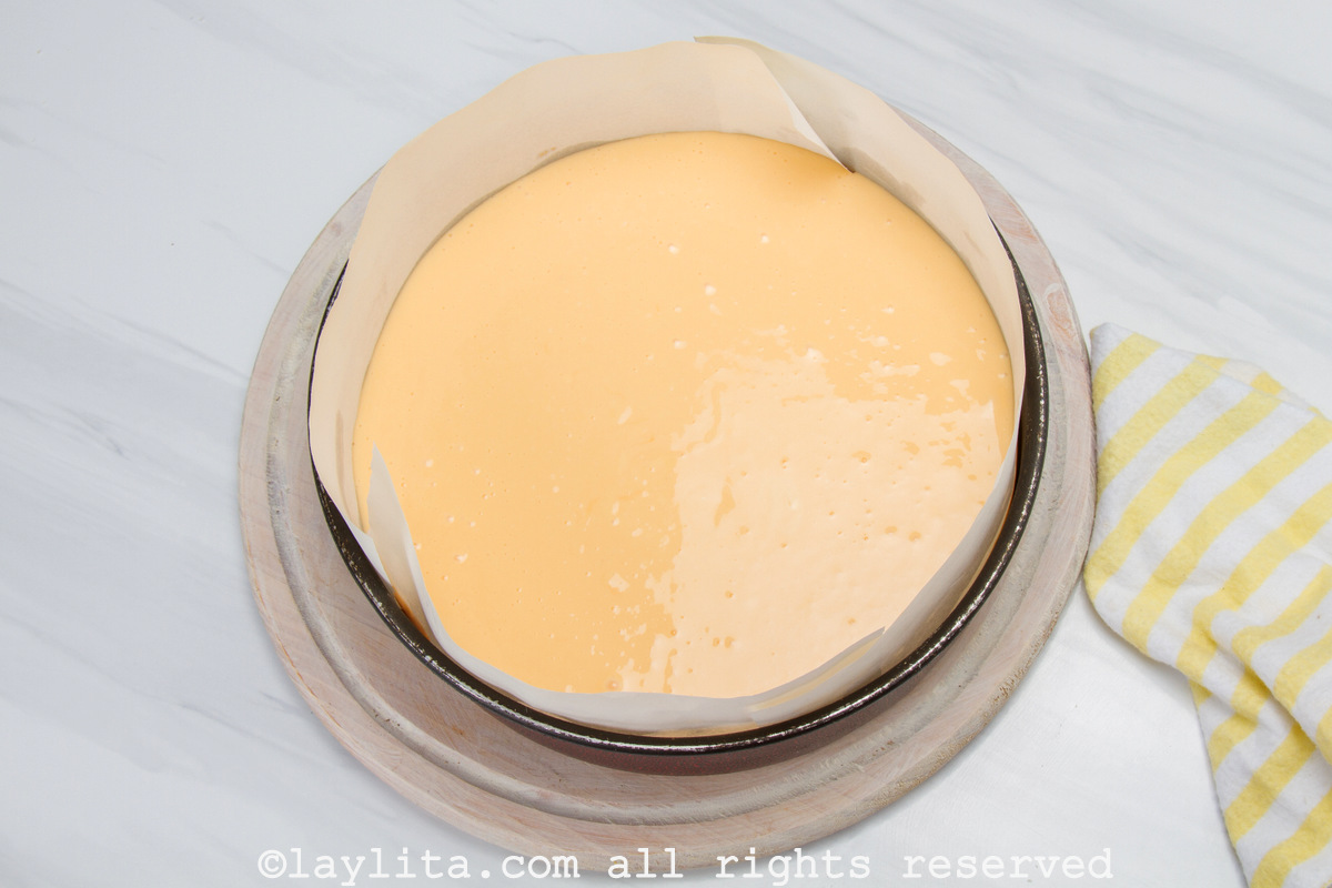 Cheesecake mixture in a spring-form cake pan before being baked.