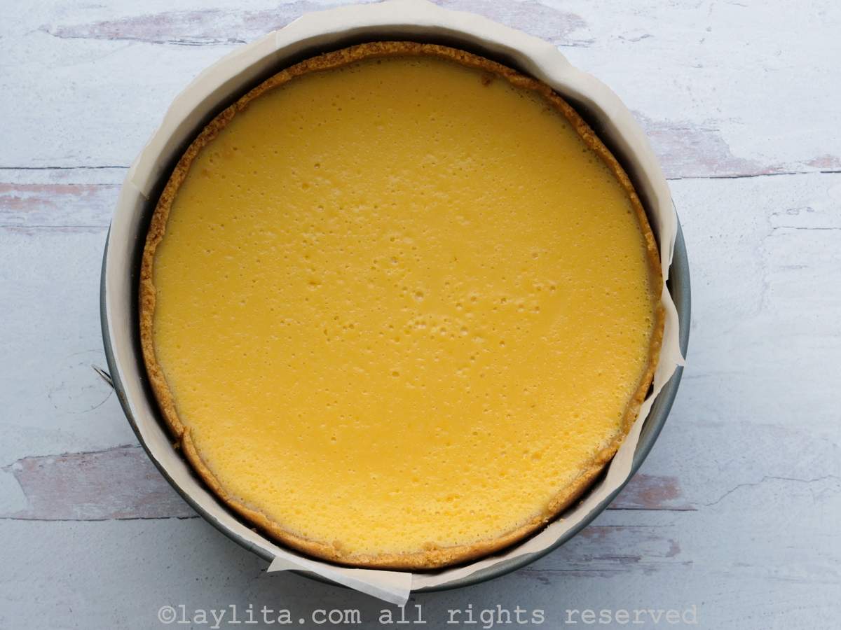 Passion fruit cheesecake in the spring-form pan after being baked.