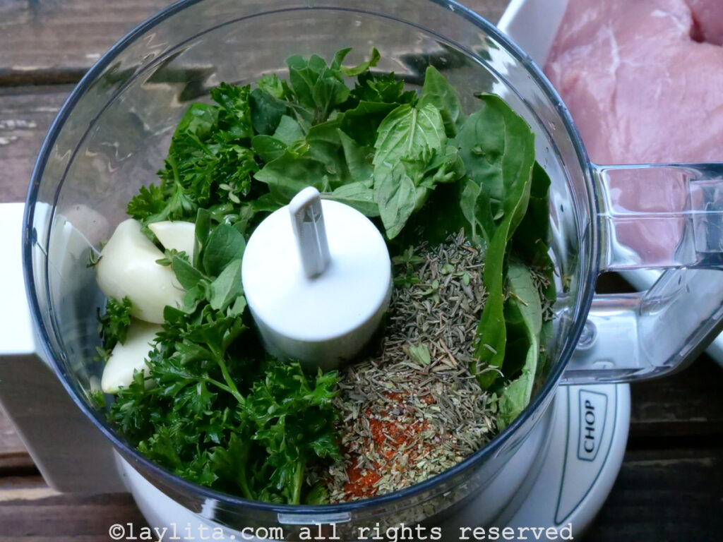 Ingredients needed for chimichurri in a food processor before being blended