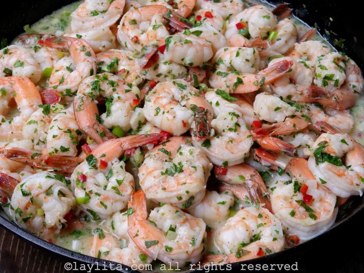 Camarones al ajillo in a skillet after they are done cooking
