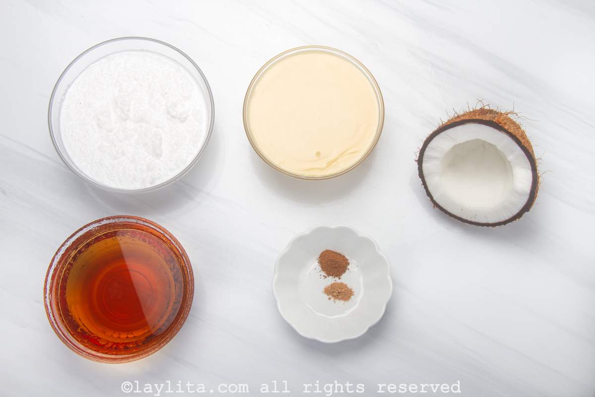 Ingredients needed for Puerto Rican Coquito on a kitchen counter