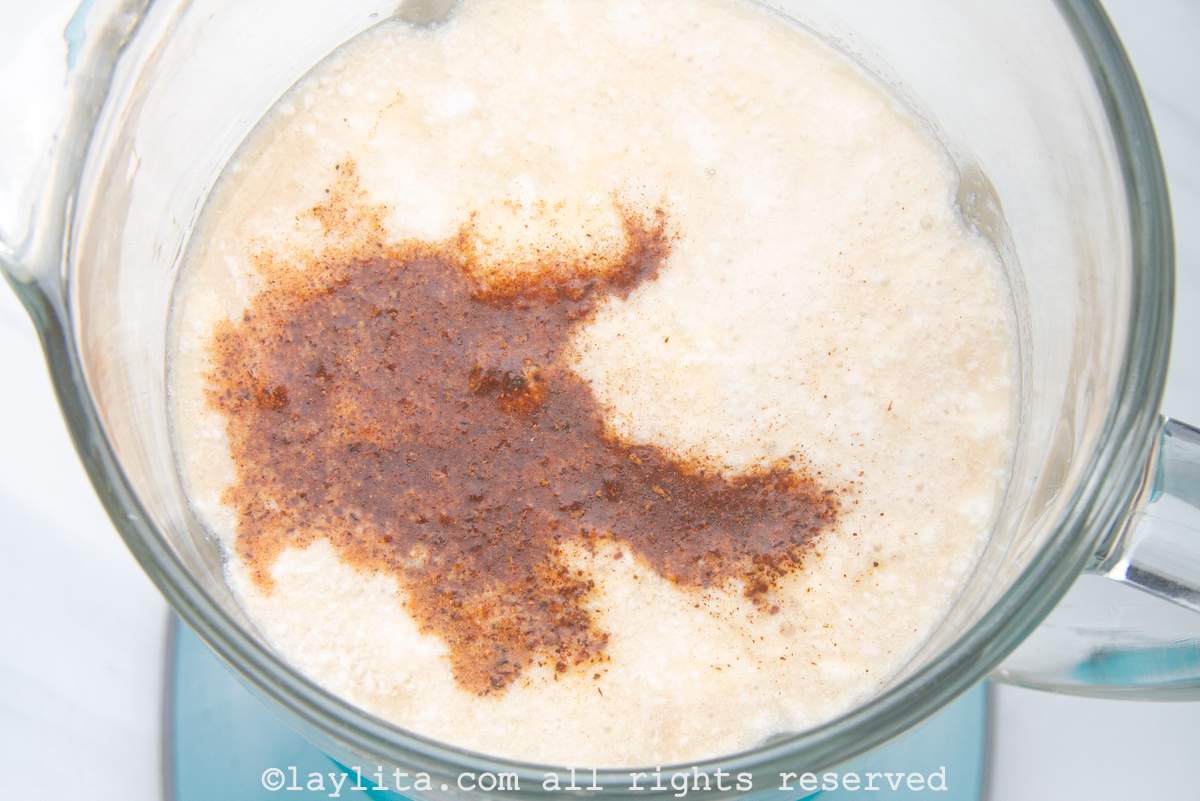 Coquito ingredients in a blender before being mixed.