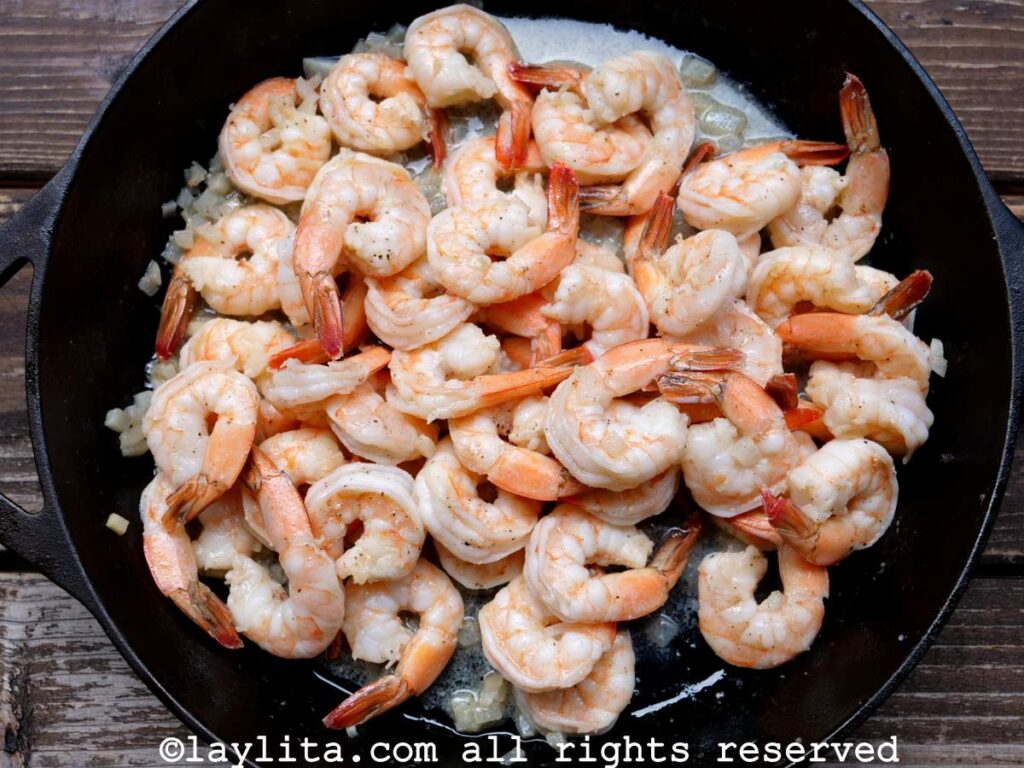 Shrimp cooking in the skillet with the garlic