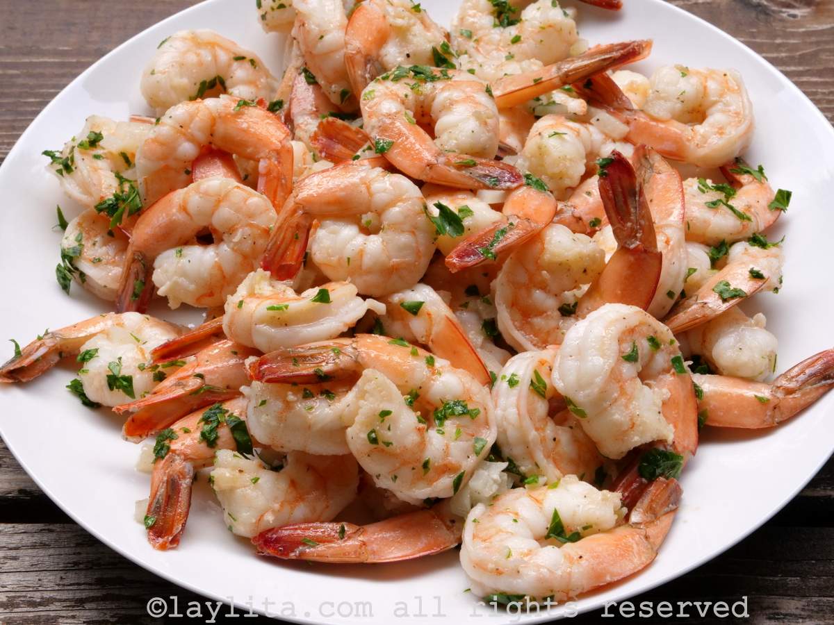 Cooked shrimp on a white plate.