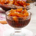 Dulce de lechosa or green papaya preserves served in a small glass dessert bowl