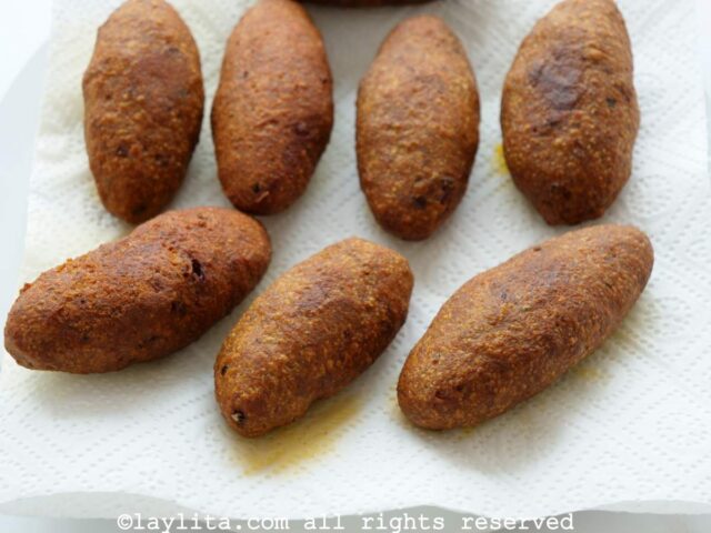 Ecuadorian plantain croquettes on plate lined with paper towels after frying