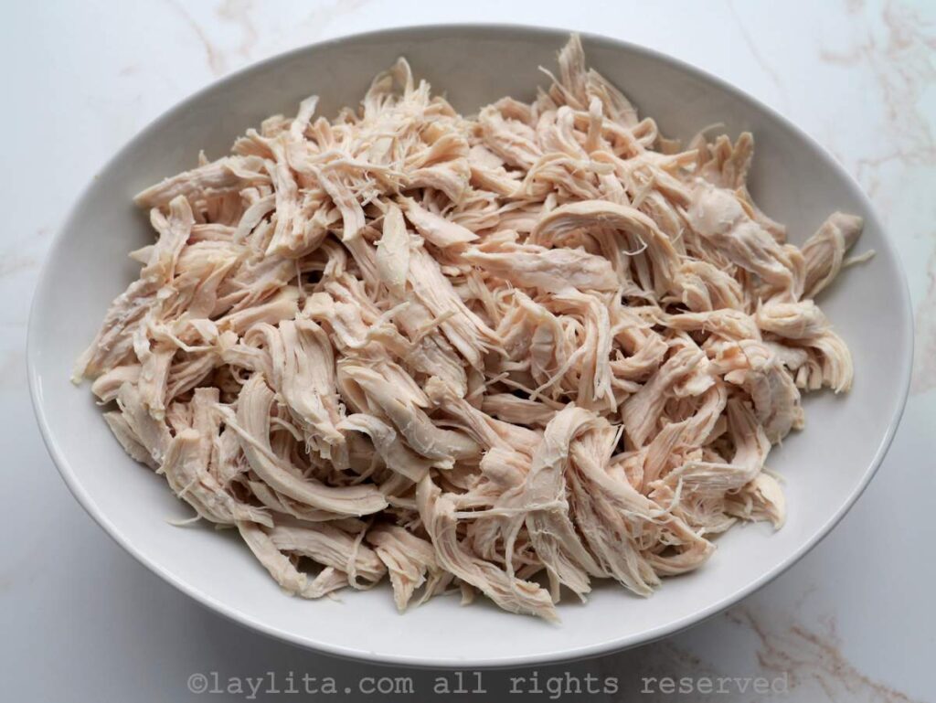 Shredded chicken in a white bowl