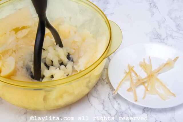 A mixing bowl with mashed yuca or cassava