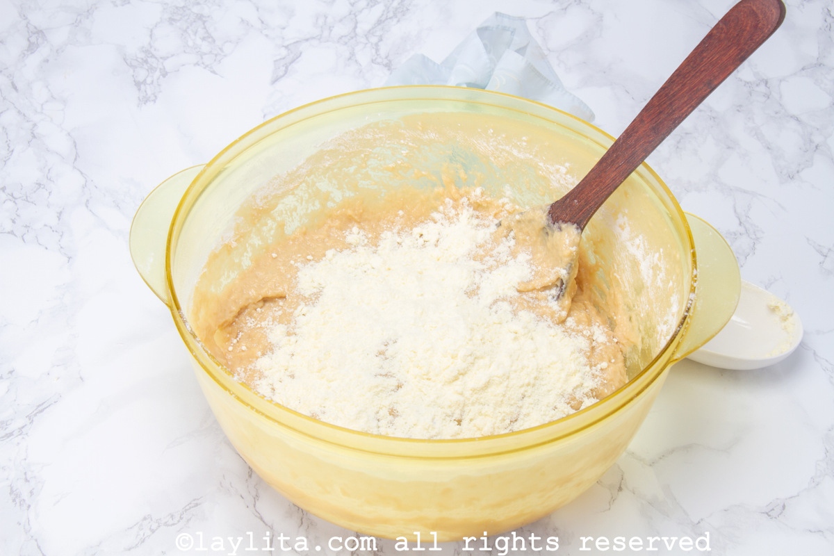 Adding the flour into the mixing bowl.