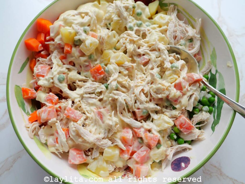 Ingredients for chicken potato salad in a large mixing bowl