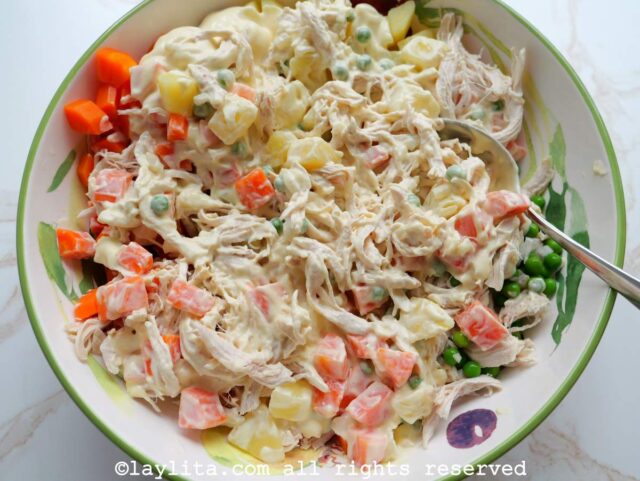 Ingredients for chicken potato salad in a large mixing bowl
