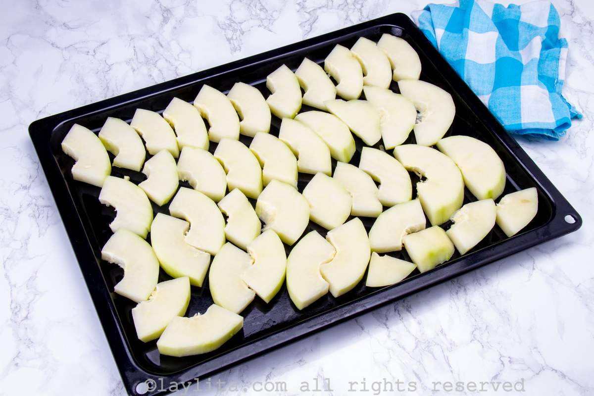 Pieces of papaya on a baking sheet