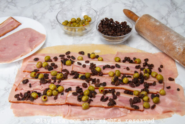 Toppings placed on top of rolled dough.