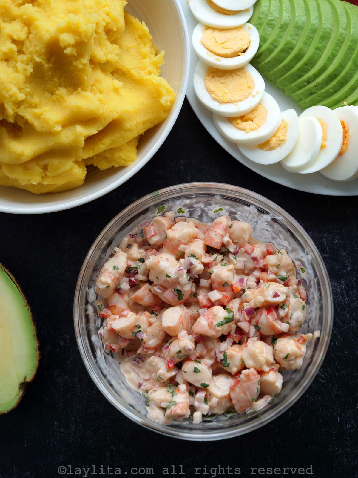Overhead shot of prepped ingredients needed to make causa de camarones.
