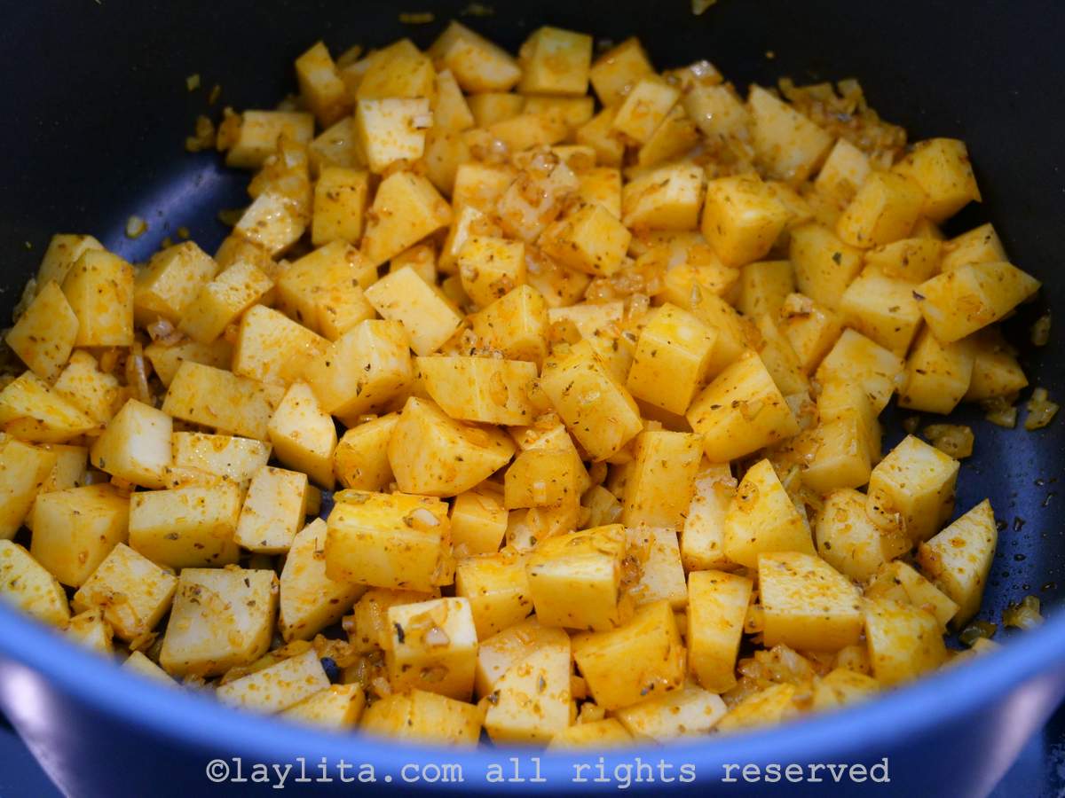 Diced potatoes mixed in with the onions, garlic and spices.