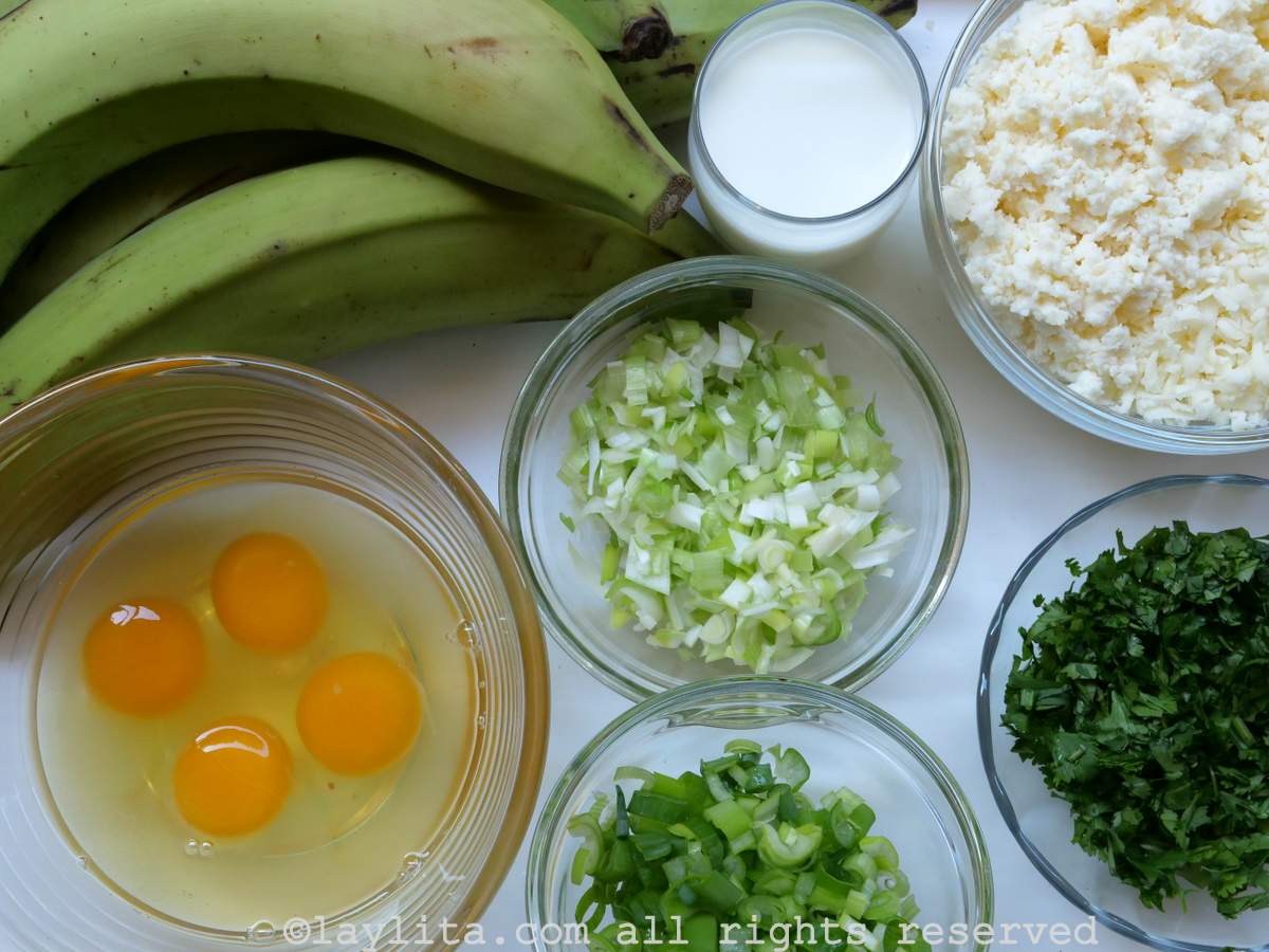 Ingredients for Ecuadorian tigrillo green plantain mash with cheese on a white table