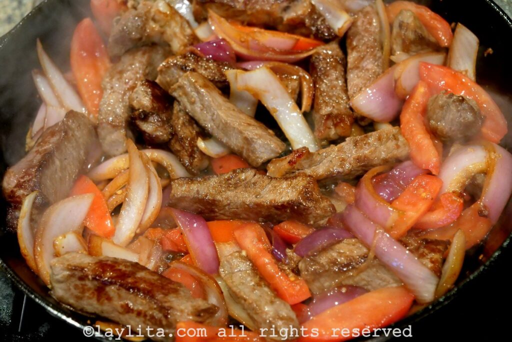 Add the beef back to the pan for the lomo saltado