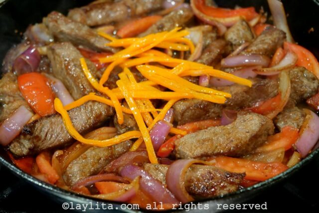 Beef added back to the pan along with Peruvian yellow peppers.