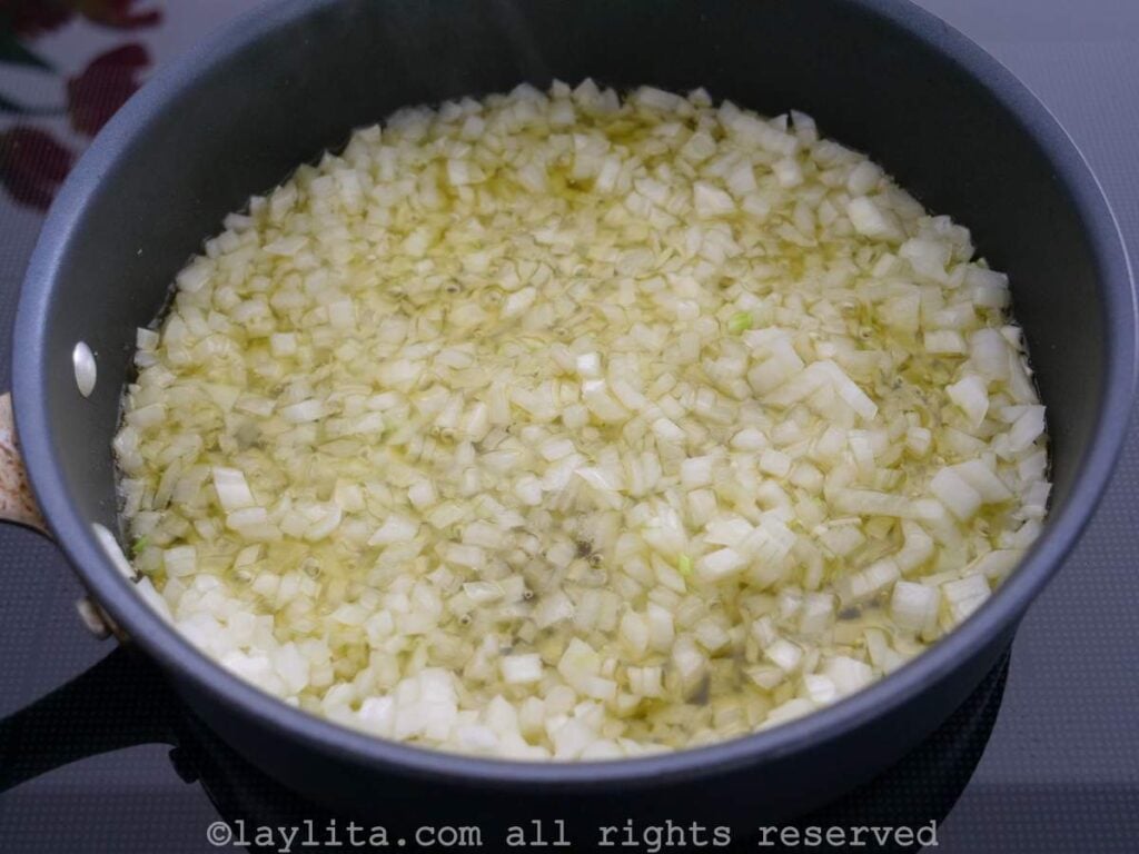 Onions being cooked in olive oil