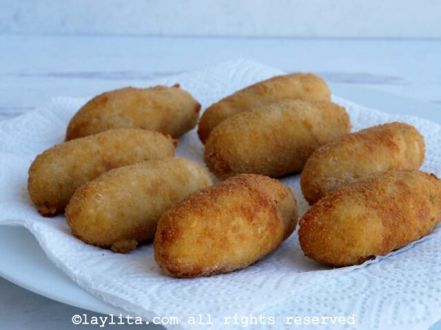 Place the fried croquetas on a plate lined with paper towels