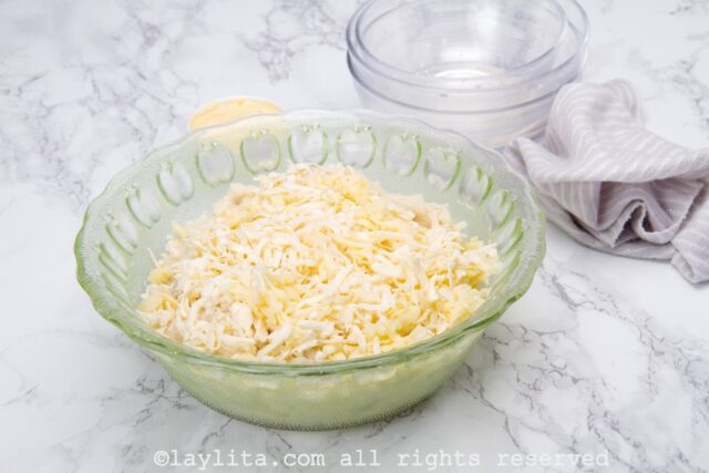 Add the grated cheese to the arepa mix