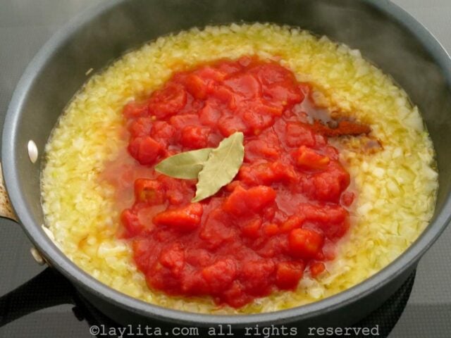 Add the tomatoes and seasonings to the cooked onions