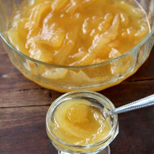 Large glass bowl of babaco preserves next to a small bowl of them.