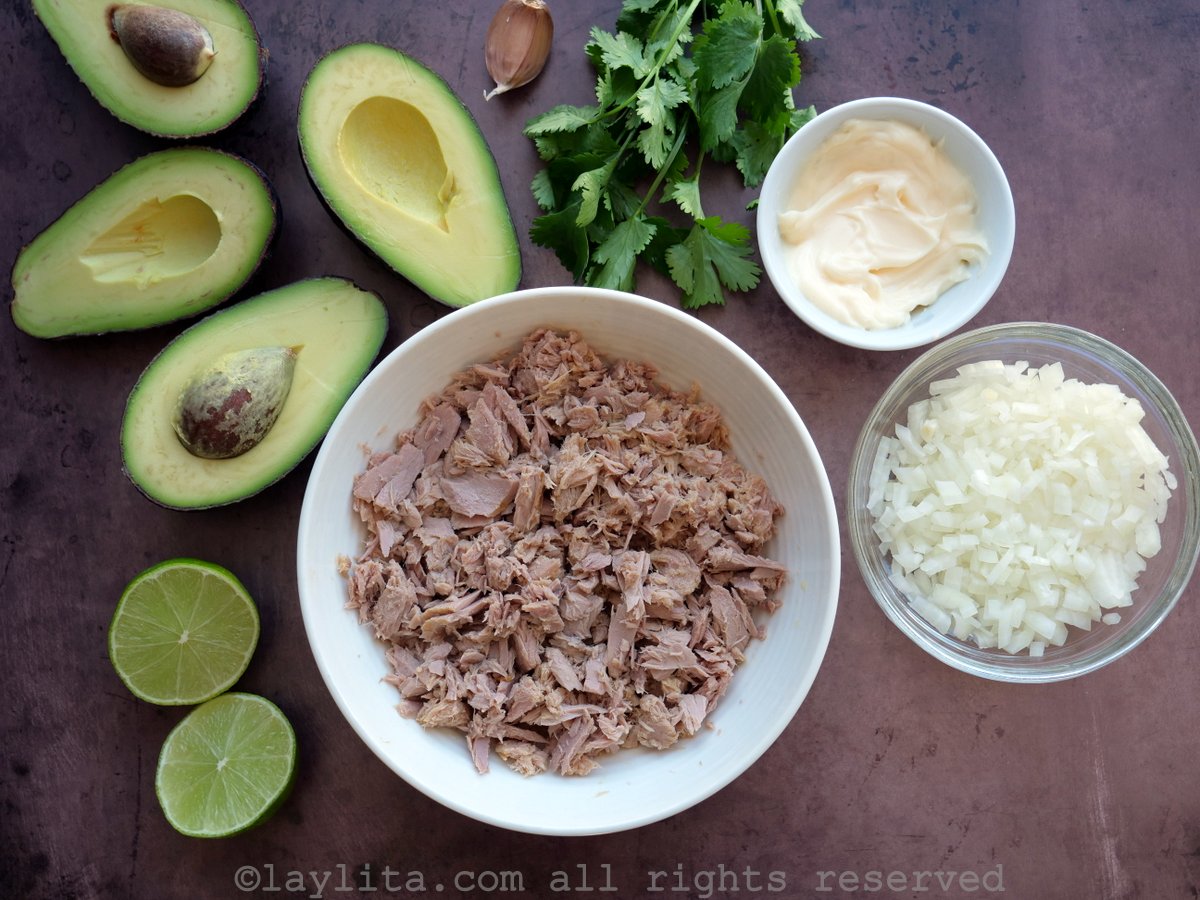 Ingredients for tuna avocado salad filling for arepas on a counter