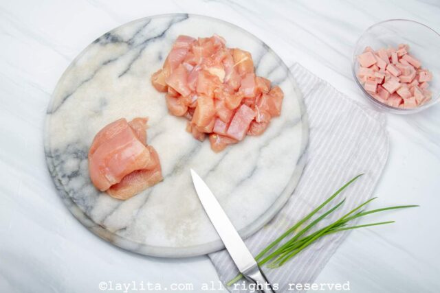 Cutting the chicken breast into cubes