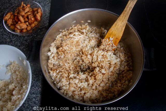 Add the cooked rice and soy sauce