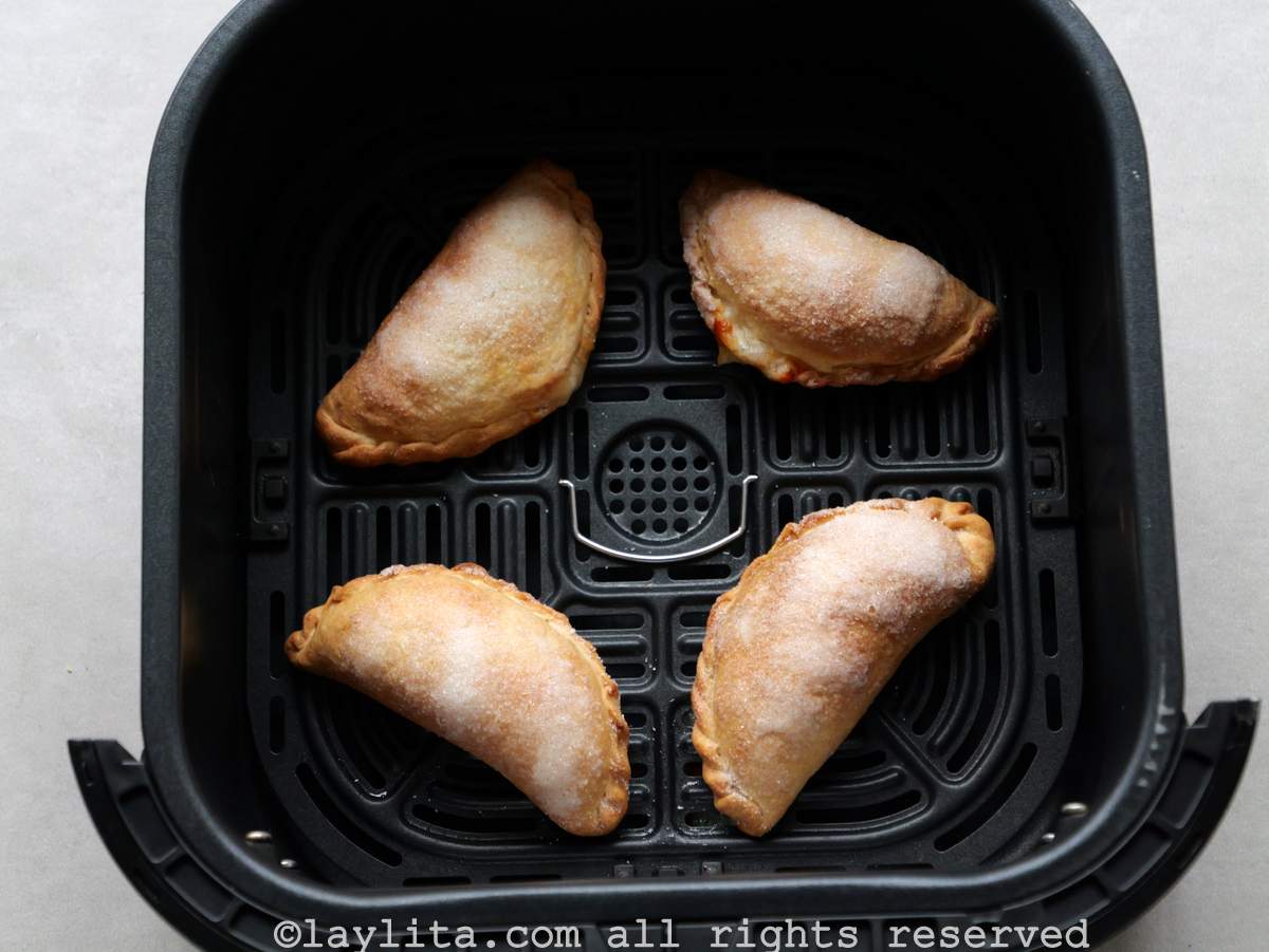 Air fryer cheese empanadas in the air fryer basket