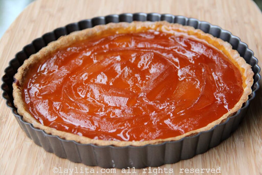 Overhead shot of babaco pie on a light wooden background
