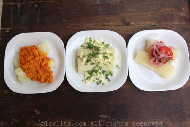 Three plates of boiled yuca each with different toppings on them