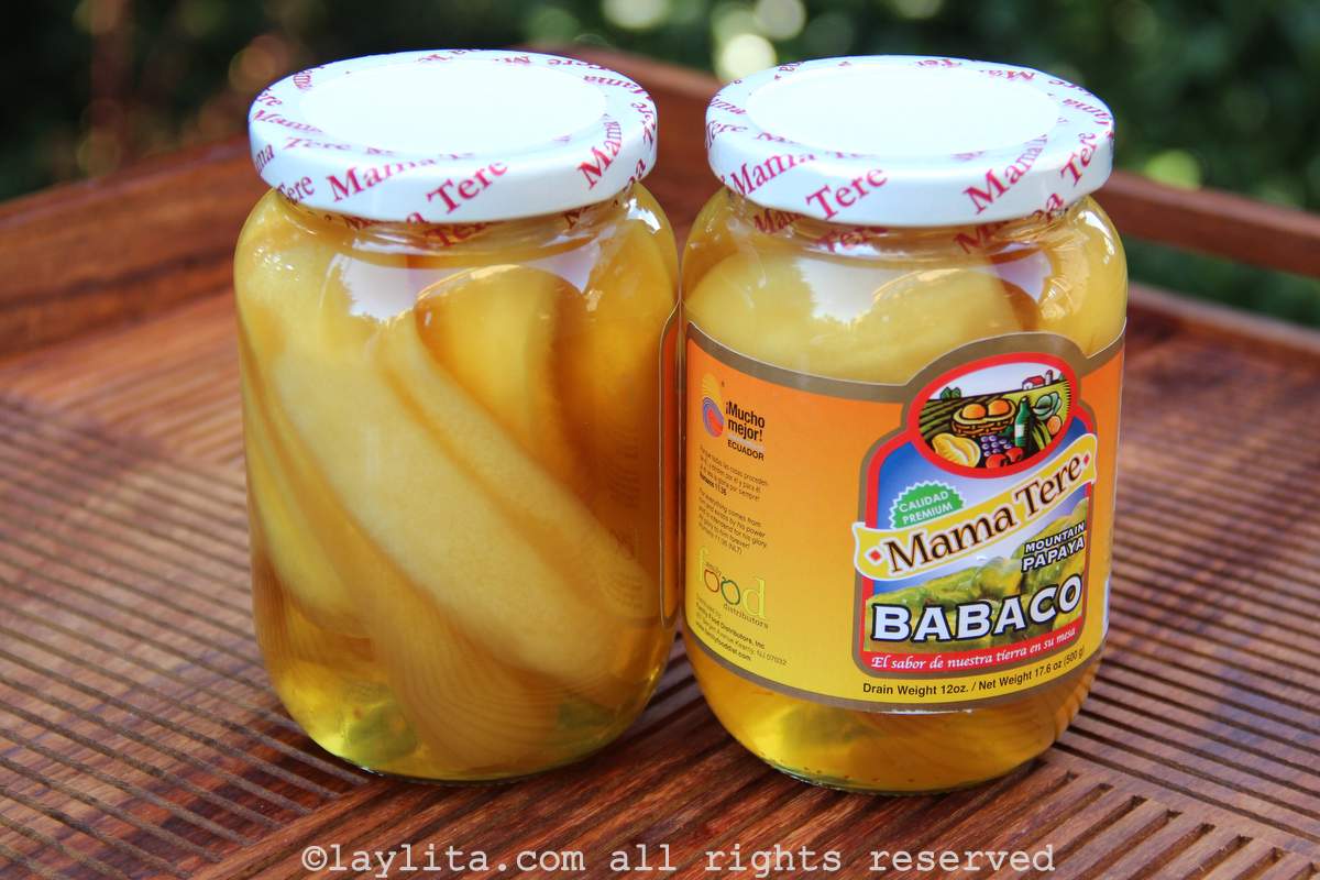 Two jars of babaco mountain papaya on a wooden background.