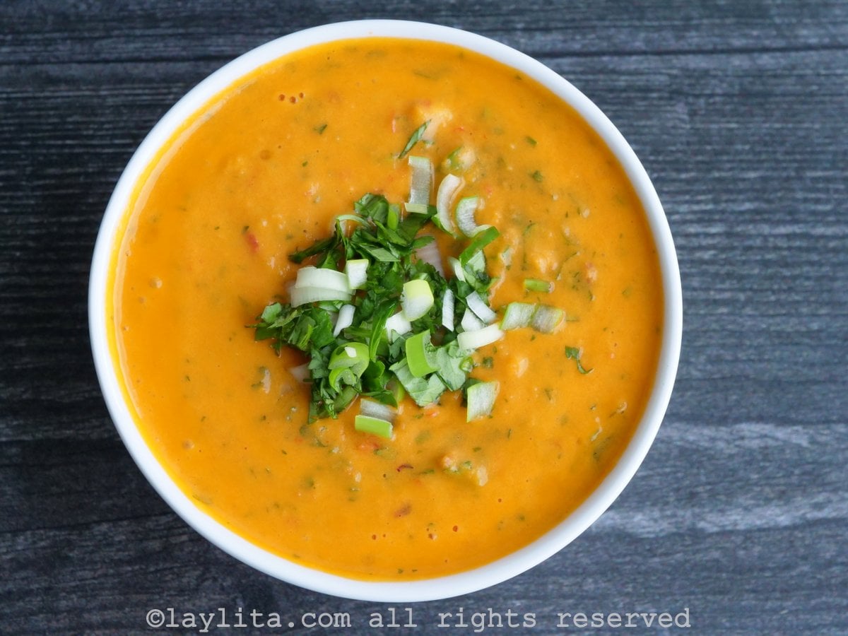 Ecuadorian aji de tomate in a white bowl on dark counter
